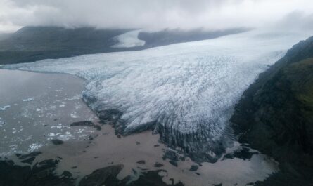 https://www.pexels.com/photo/majestic-glacier-tongue-reaching-seashore-under-gloomy-misty-sky-4338103/