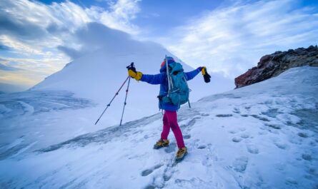 https://www.pexels.com/photo/adventurous-hiker-ascends-snowy-mountain-peak-33950240/