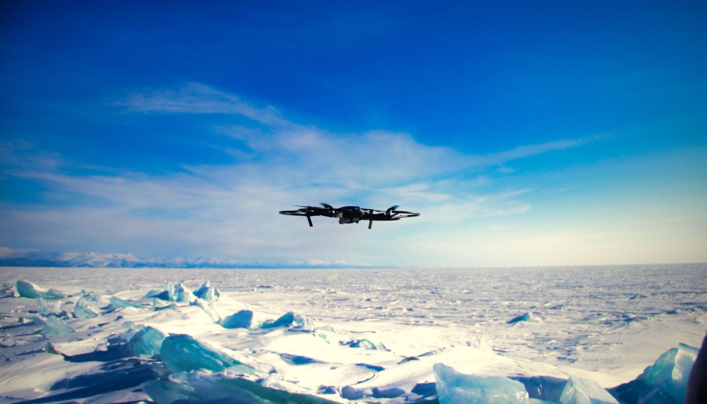https://www.pexels.com/photo/a-plane-flying-over-the-ice-with-a-blue-sky-16295036/